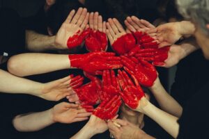 Collection of hands sharing a heart